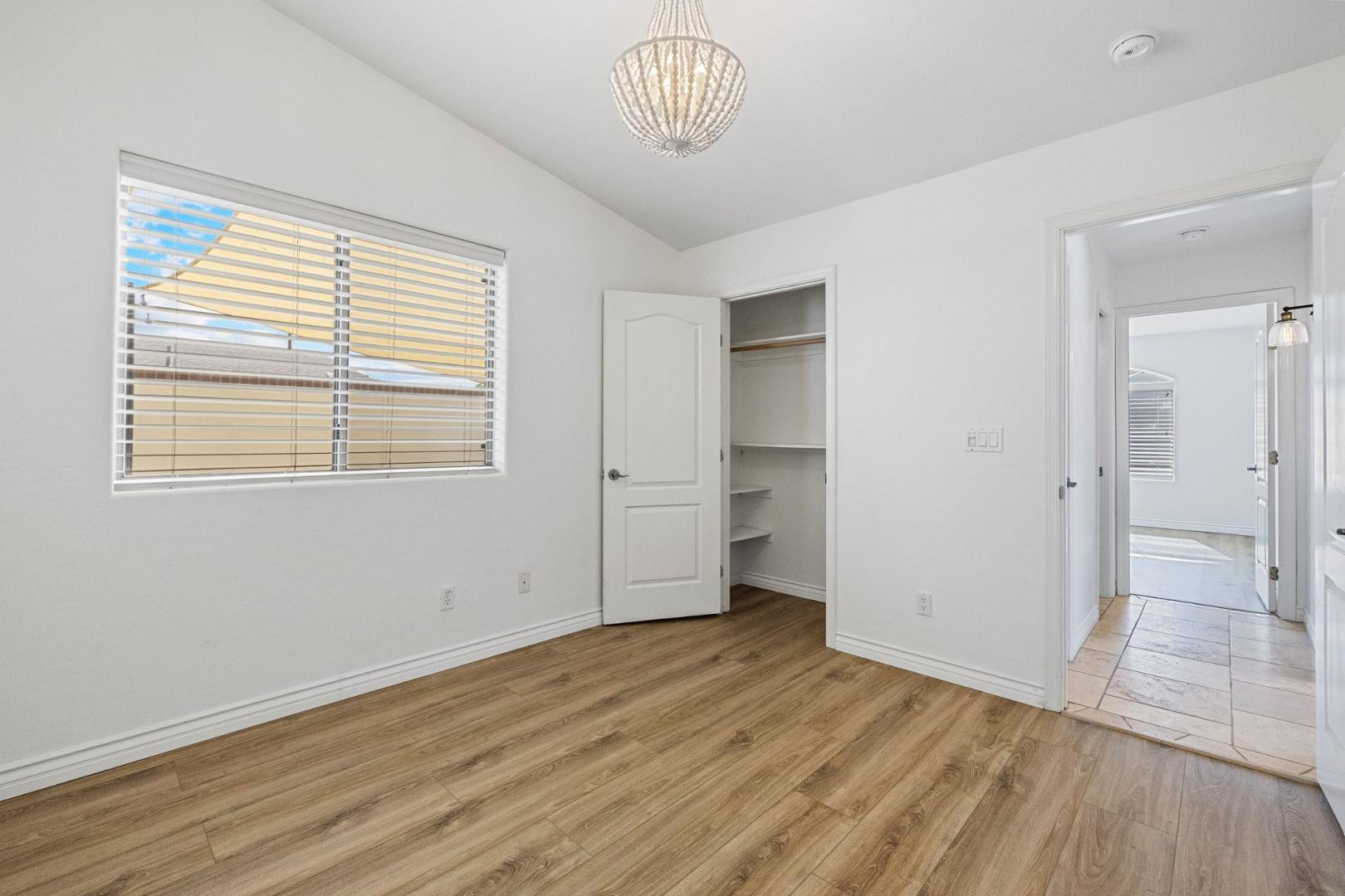 5233 North 15th Street Phoenix, AZ 85014 - Photo 25 of 55 a view of empty room with wooden floor and fan