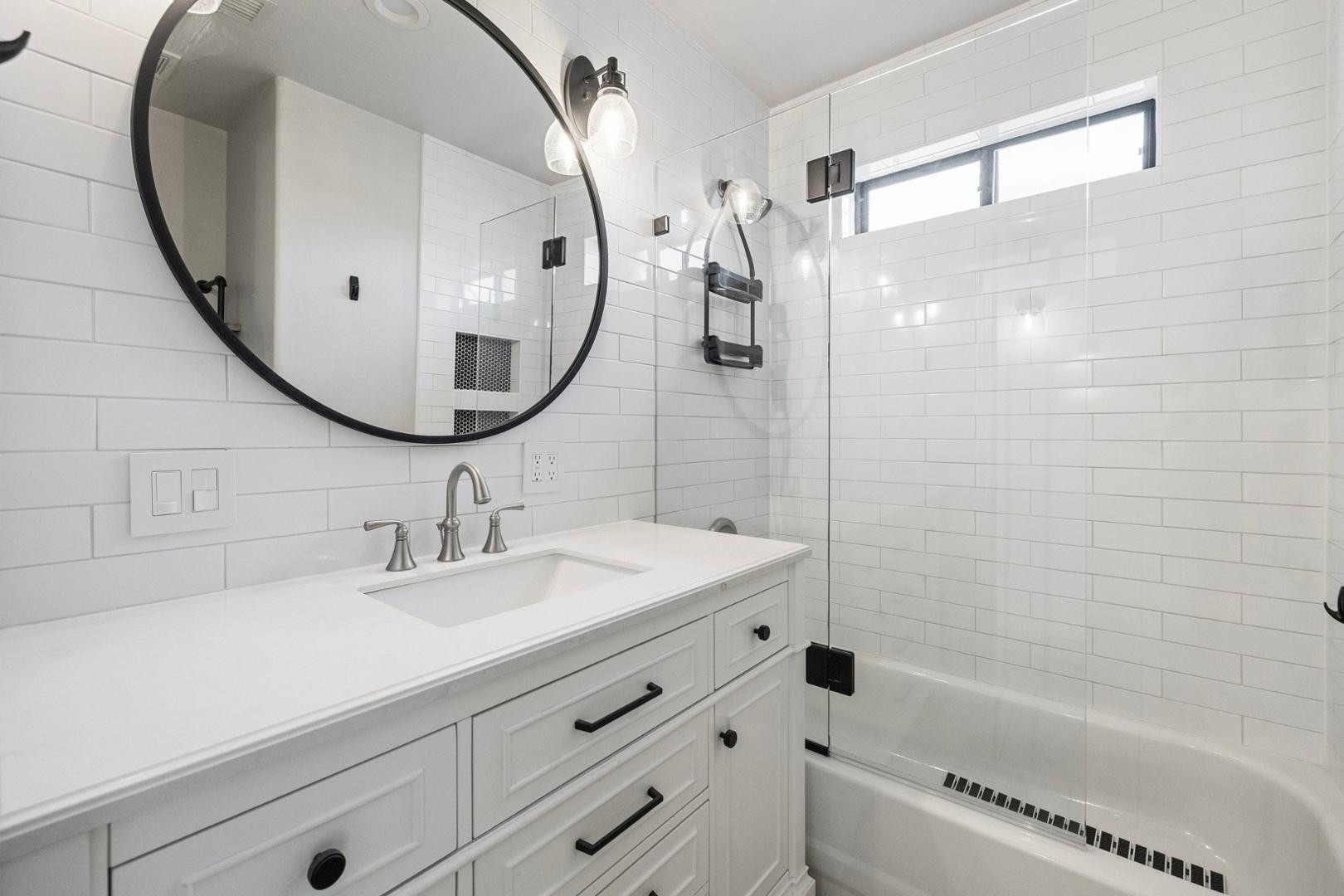 5233 North 15th Street Phoenix, AZ 85014 - Photo 26 of 55 a bathroom with a sink and a mirror