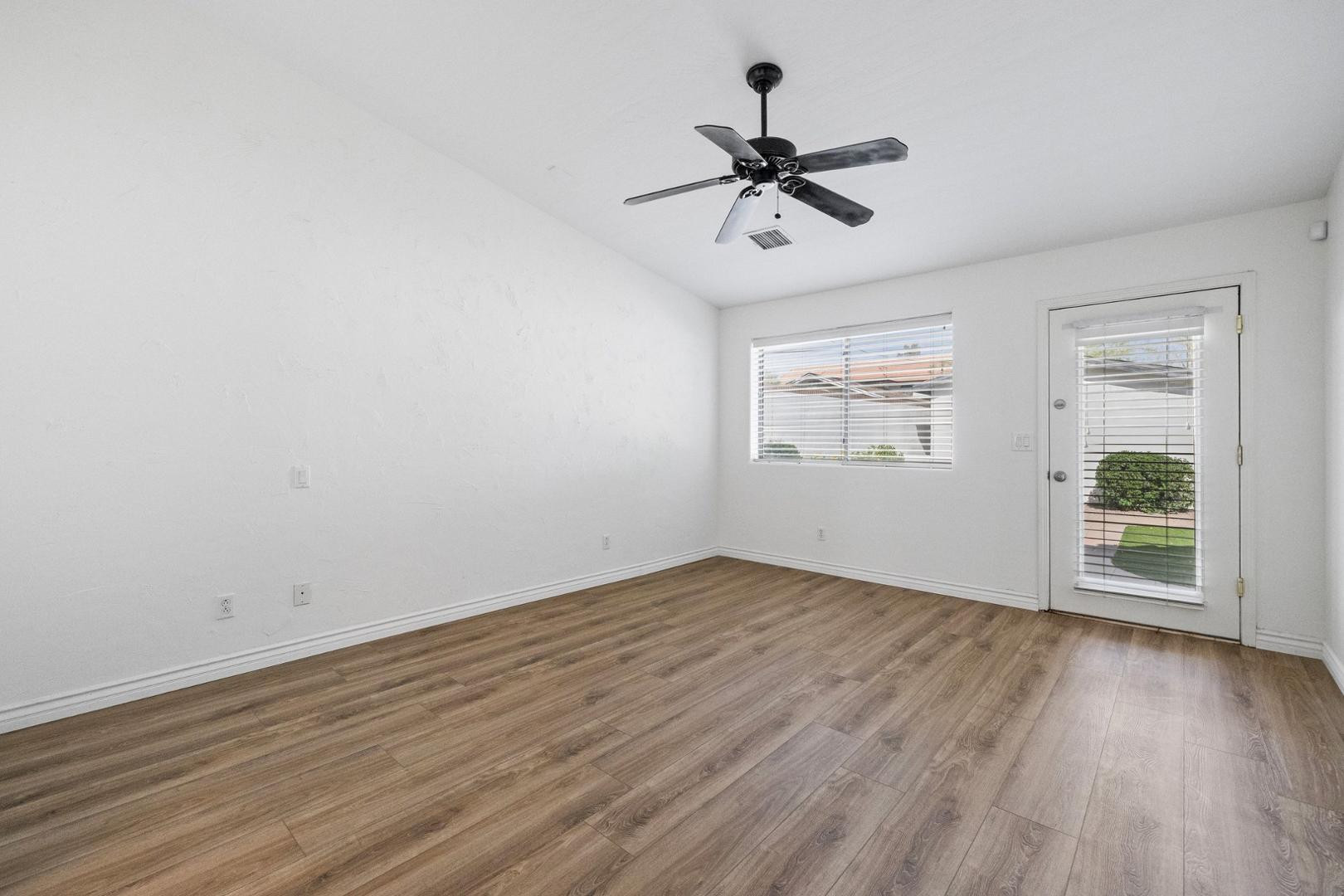 5233 North 15th Street Phoenix, AZ 85014 - Photo 30 of 55 a view of empty room with wooden floor and fan