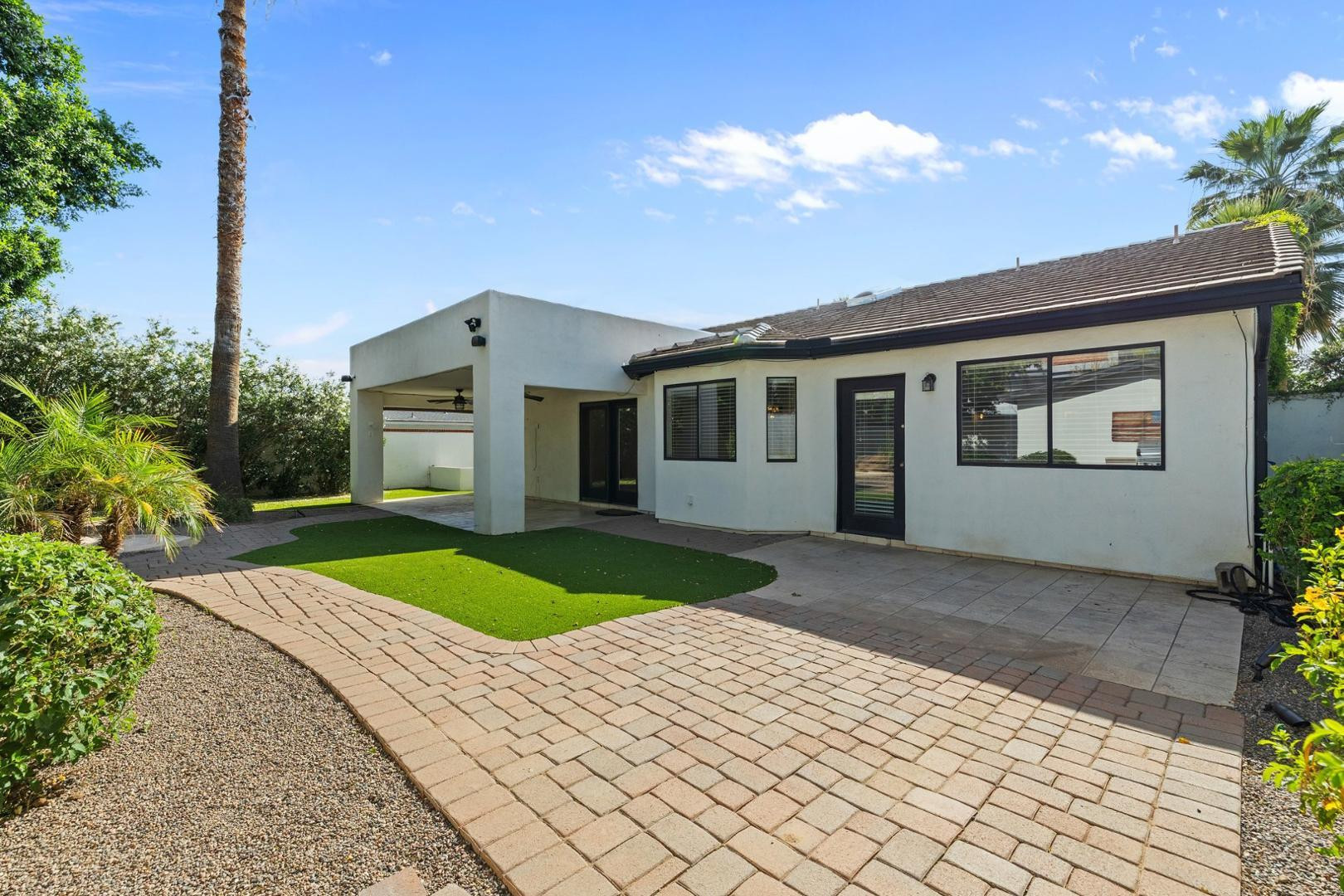 5233 North 15th Street Phoenix, AZ 85014 - Photo 40 of 55 a front view of a house with a yard and garage