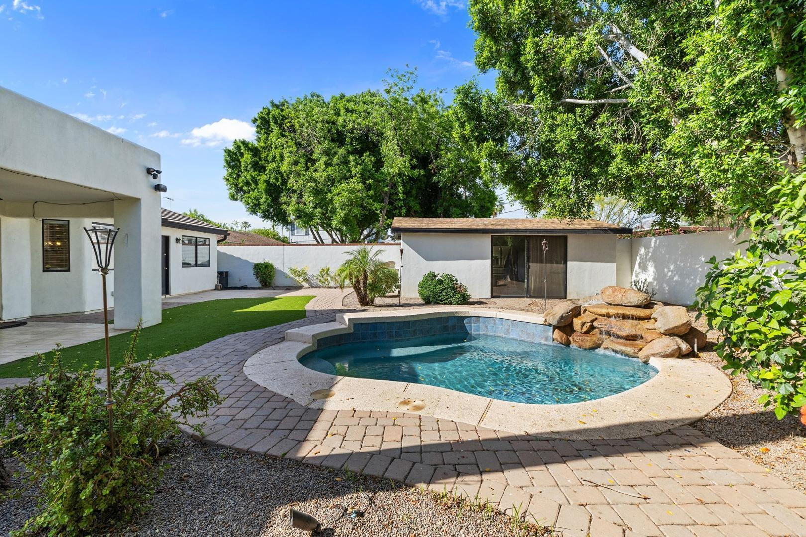 5233 North 15th Street Phoenix, AZ 85014 - Photo 43 of 55 a view of house with swimming pool outdoor seating