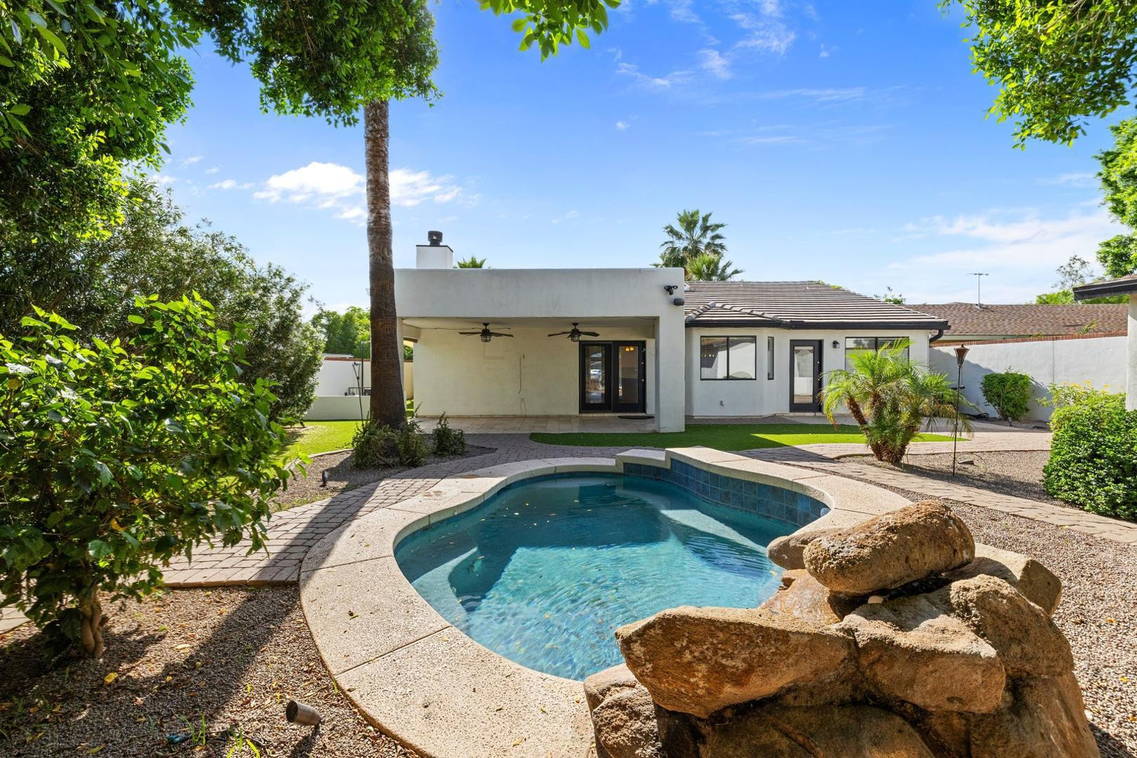 5233 North 15th Street Phoenix, AZ 85014 - Photo 46 of 55 a view of a house with swimming pool and a porch