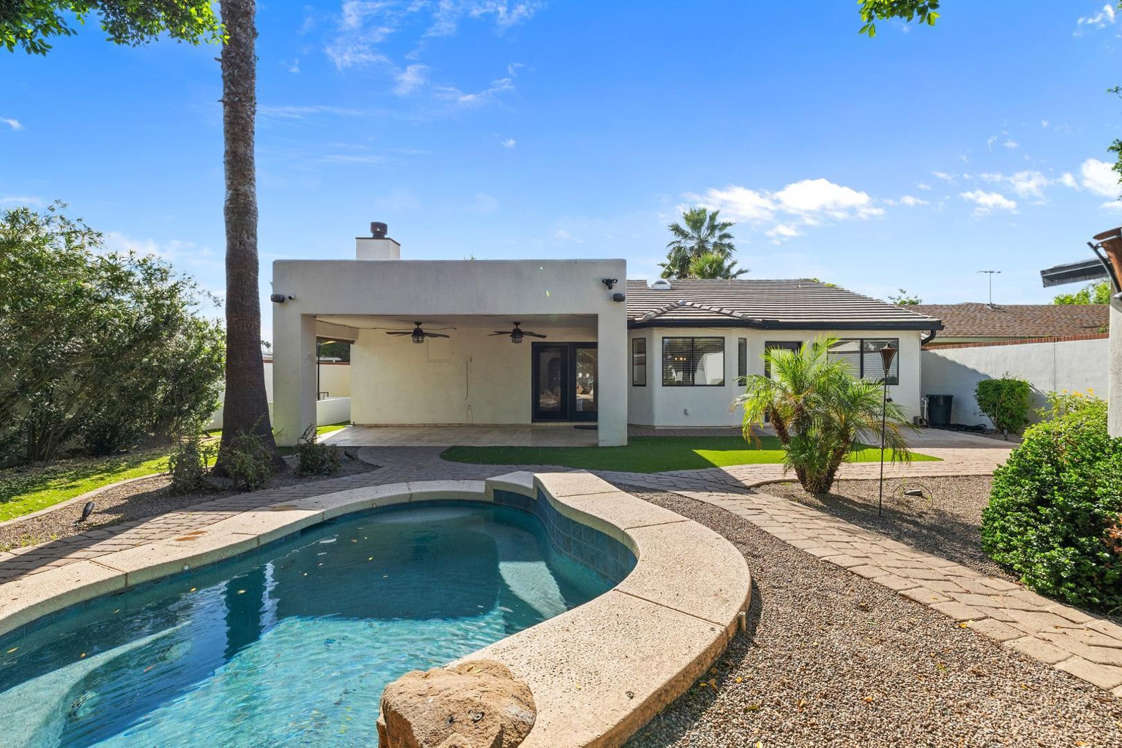 5233 North 15th Street Phoenix, AZ 85014 - Photo 47 of 55 a view of house with swimming pool outdoor seating