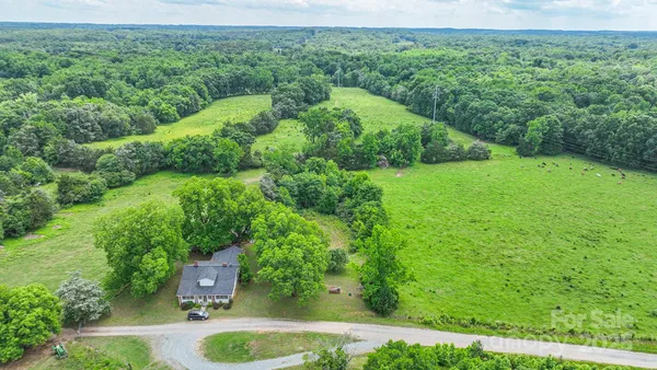 an aerial view of residential house with outdoor space