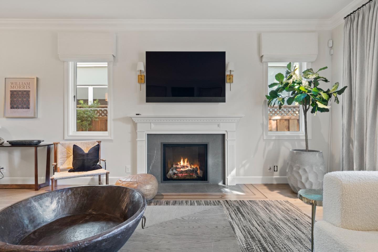 1153 Cabrillo Avenue Burlingame, CA 94010 - Photo 23 of 80 a living room with furniture and a fireplace