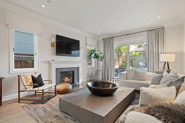 a bathroom with a granite countertop sink mirror and window