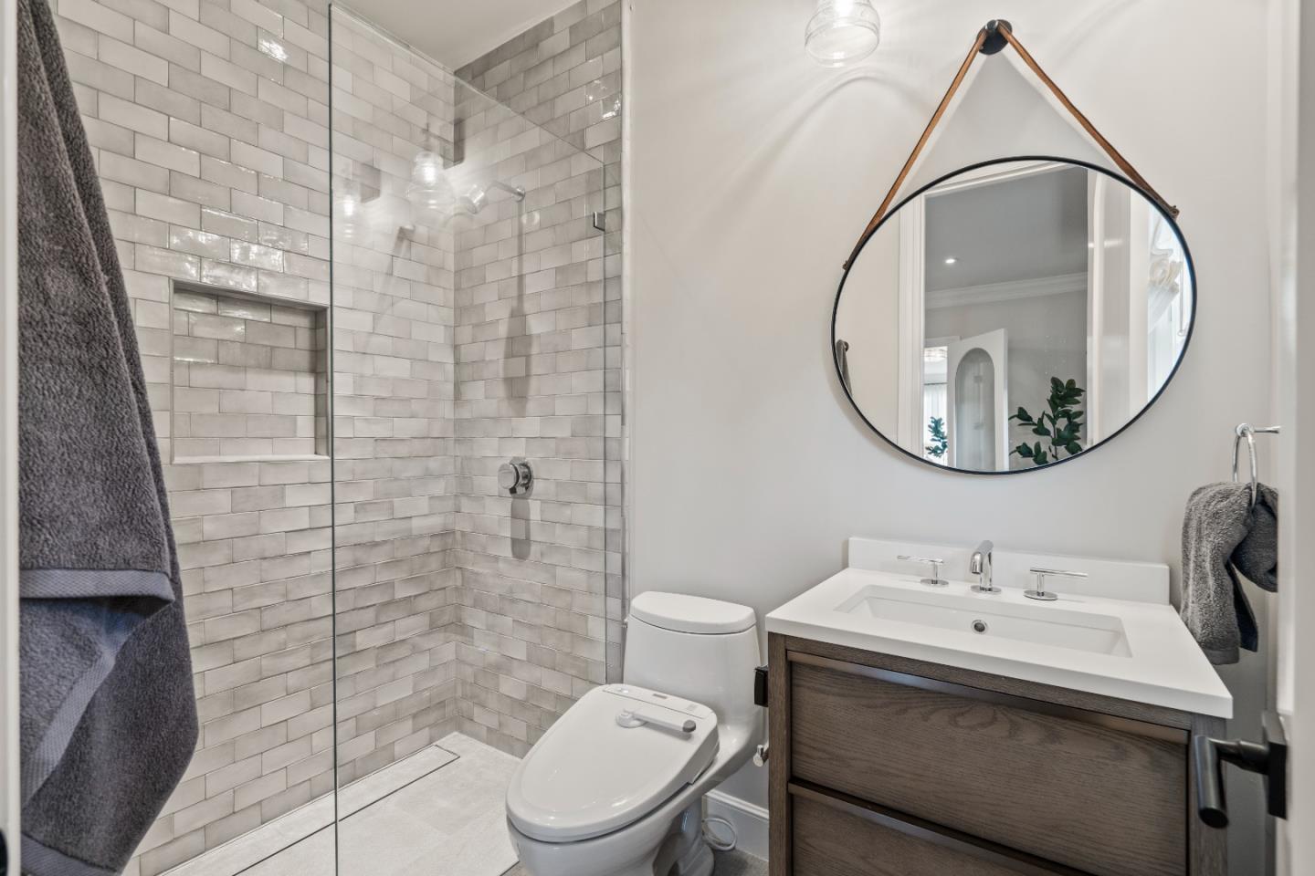 1153 Cabrillo Avenue Burlingame, CA 94010 - Photo 31 of 80 a bathroom with a sink a toilet and a mirror