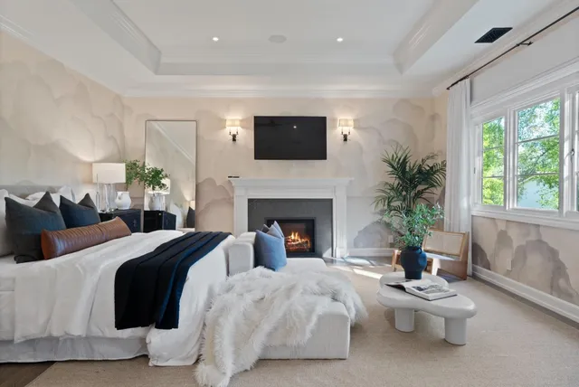 a bedroom with a bed and a lamp