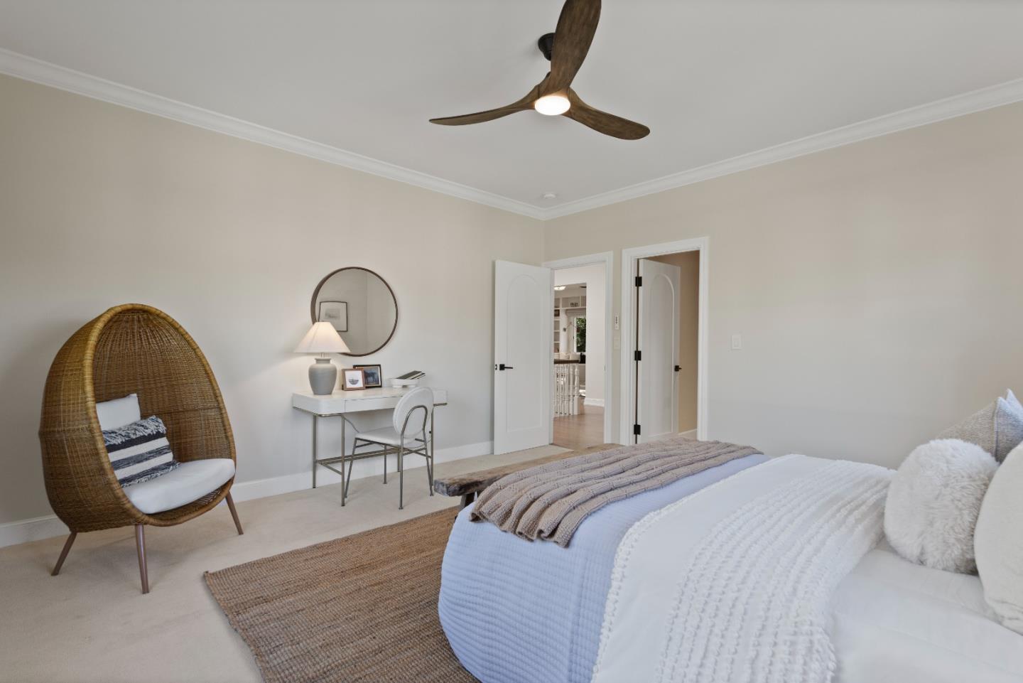 1153 Cabrillo Avenue Burlingame, CA 94010 - Photo 47 of 80 a bedroom with a bed a chandelier and chair