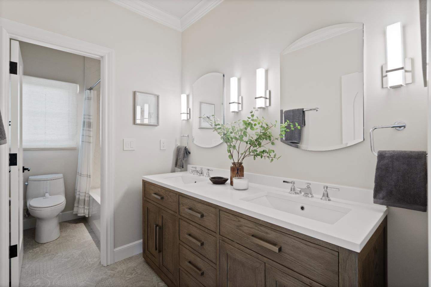 1153 Cabrillo Avenue Burlingame, CA 94010 - Photo 49 of 80 a bathroom with a double vanity sink toilet and a mirror
