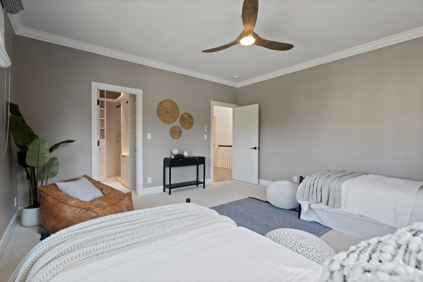 1153 Cabrillo Avenue Burlingame, CA 94010 - Photo 53 of 80 a bedroom with a bed and a chandelier