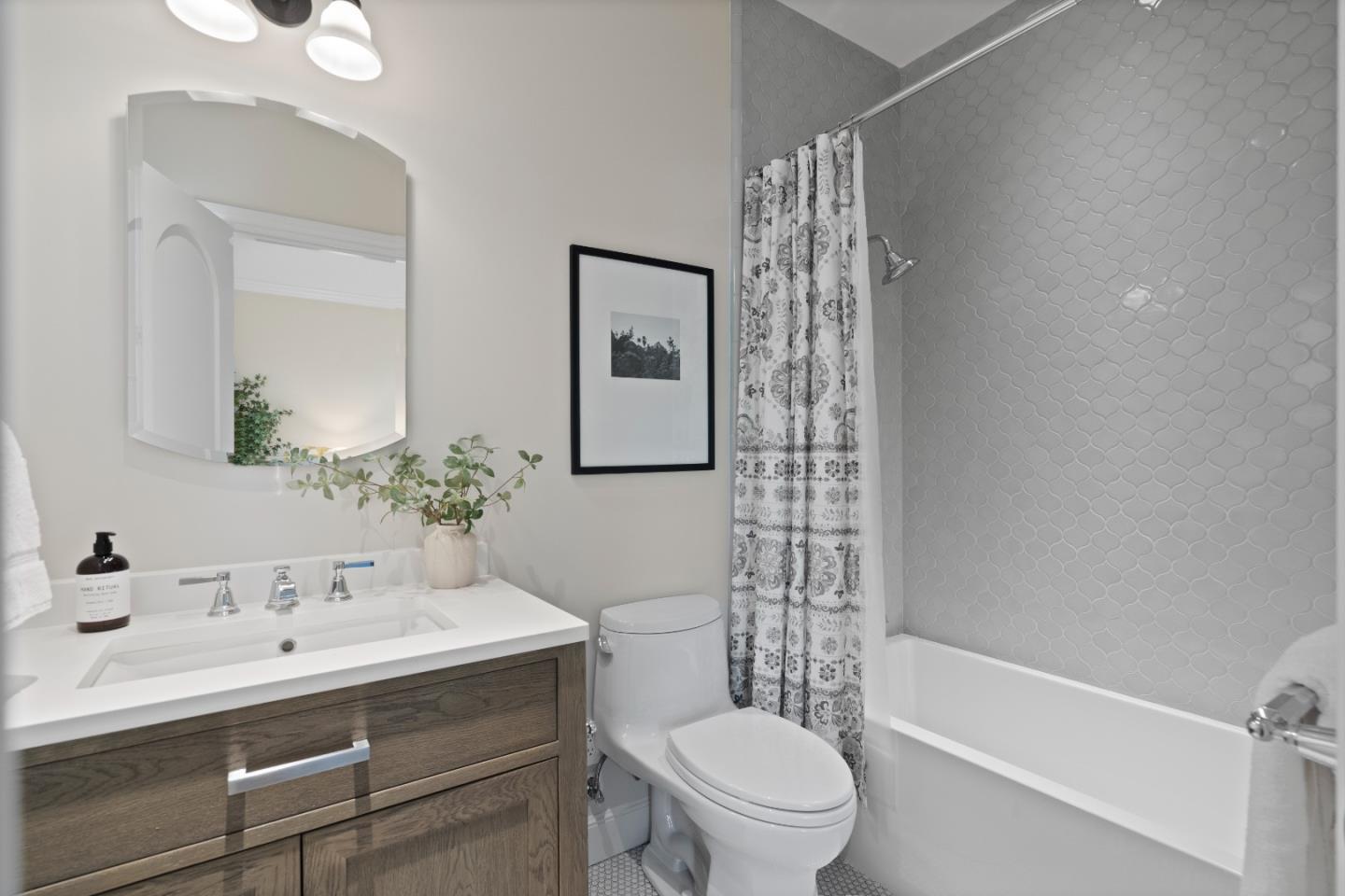 1153 Cabrillo Avenue Burlingame, CA 94010 - Photo 58 of 80 a bathroom with a sink a toilet and shower