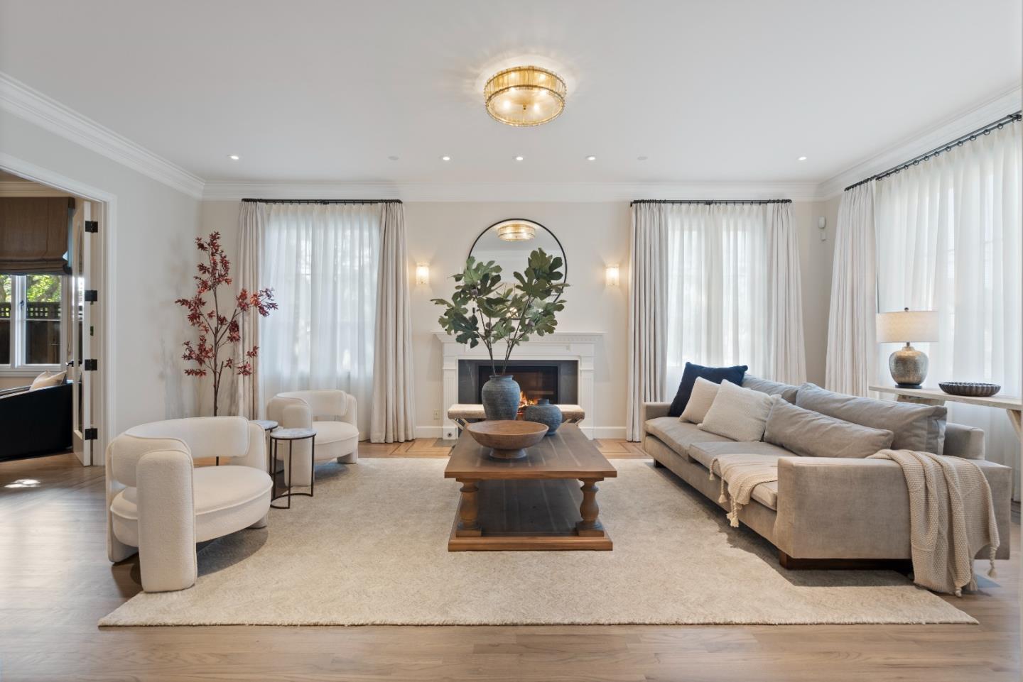 1153 Cabrillo Avenue Burlingame, CA 94010 - Photo 6 of 80 a living room with furniture and a chandelier