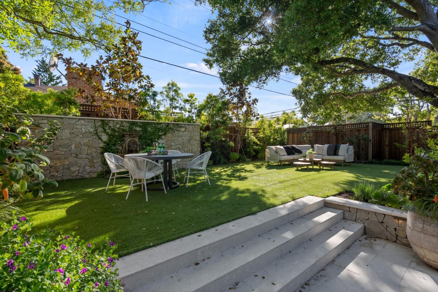 1153 Cabrillo Avenue Burlingame, CA 94010 - Photo 62 of 80 a view of a table and chairs in the garden