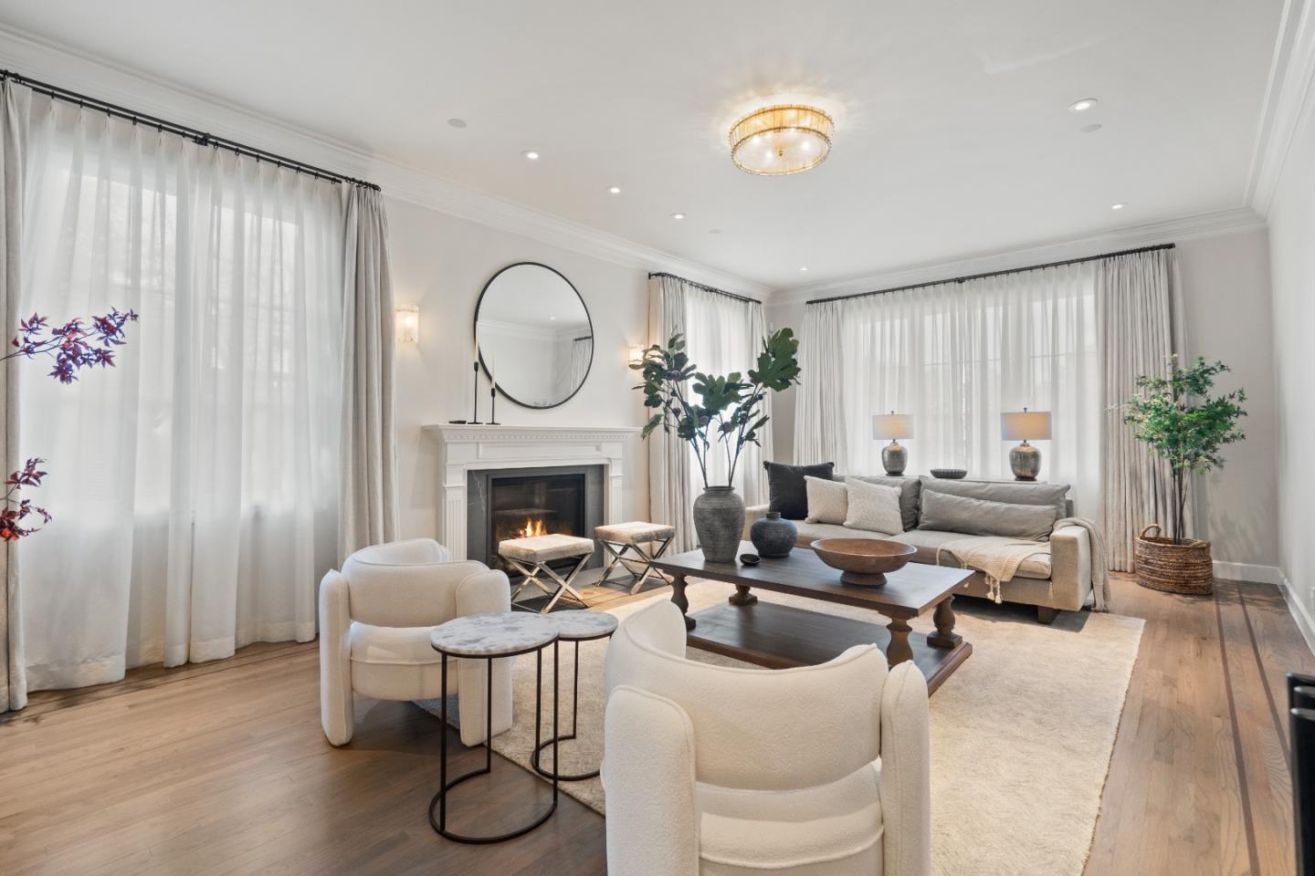 1153 Cabrillo Avenue Burlingame, CA 94010 - Photo 8 of 80 a living room with furniture a fireplace and potted plants