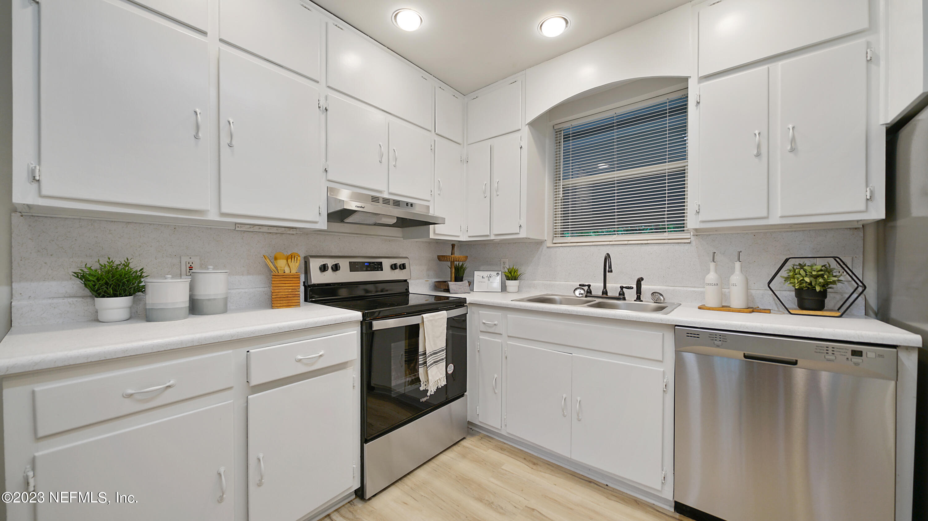 1130 Labelle Street Jacksonville, FL 32205 - Photo 13 of 24 a kitchen with stainless steel appliances granite countertop a sink a stove and cabinets