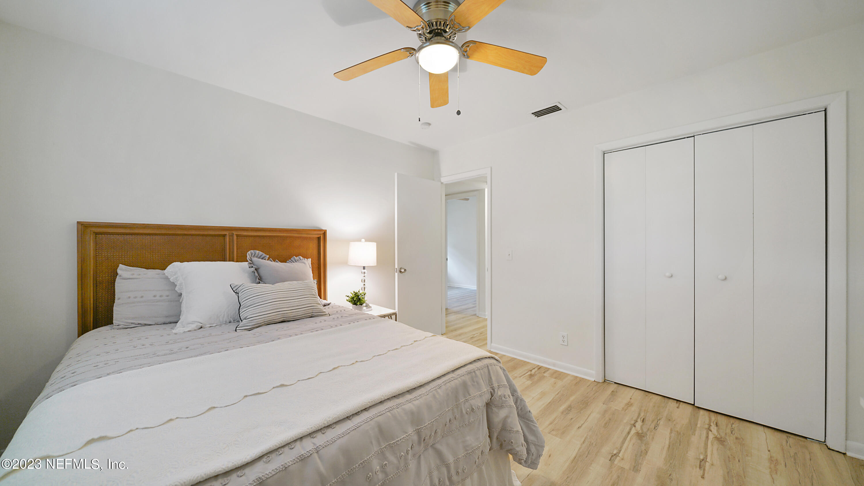 1130 Labelle Street Jacksonville, FL 32205 - Photo 17 of 24 a bedroom with a bed and a chandelier
