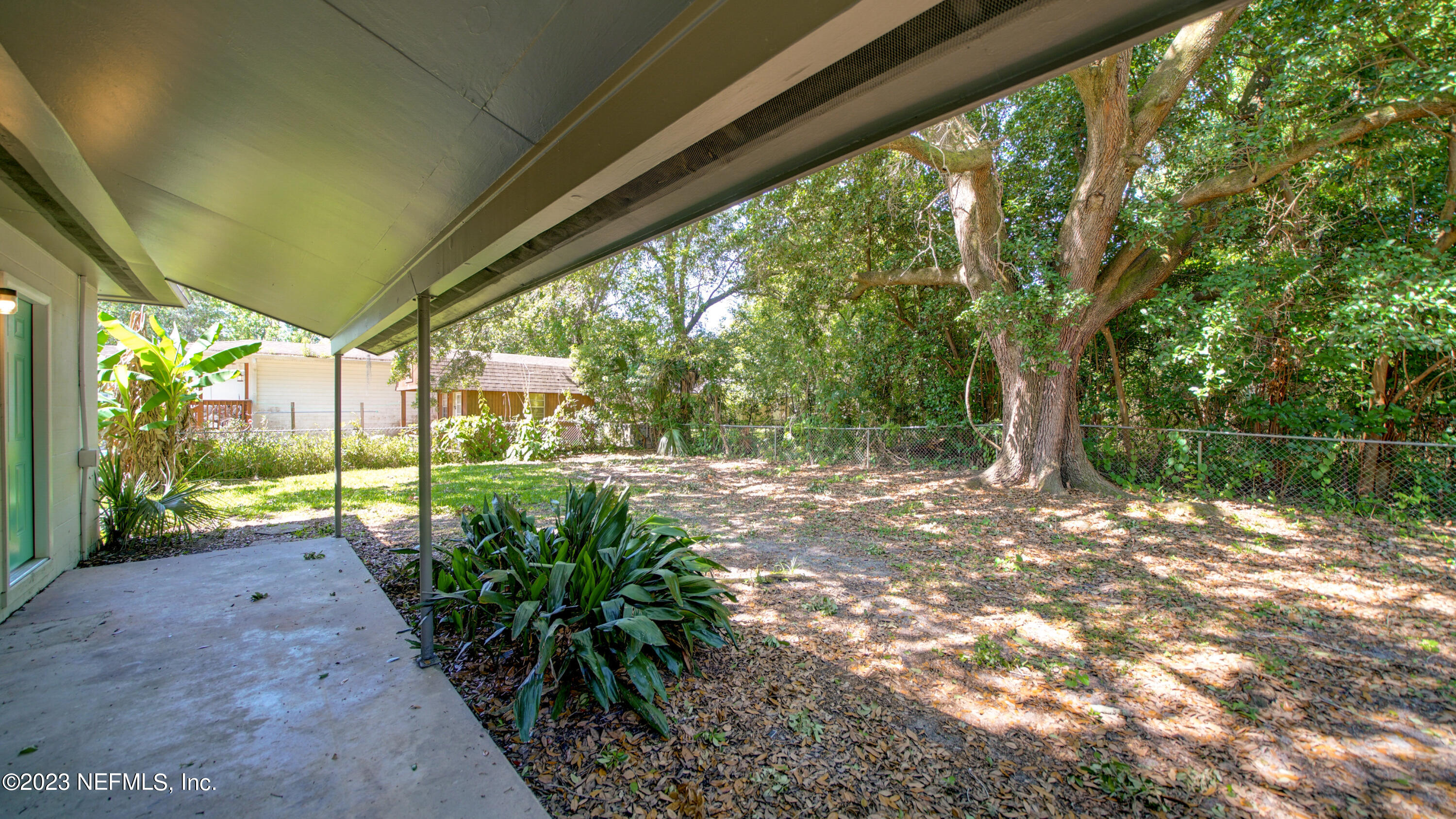 1130 Labelle Street Jacksonville, FL 32205 - Photo 20 of 24 a view of backyard with large trees and plants