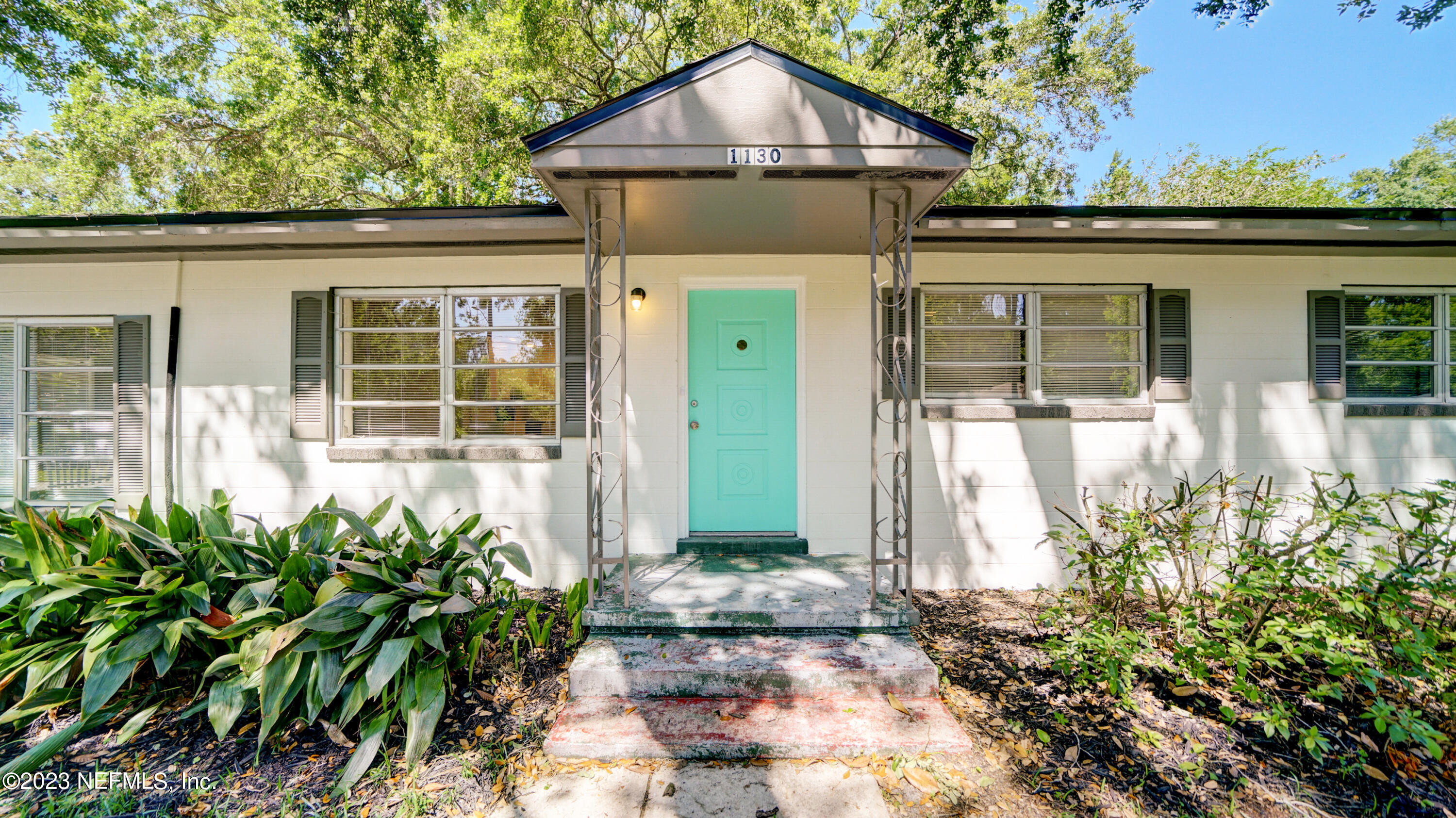 1130 Labelle Street Jacksonville, FL 32205 - Photo 2 of 24 front view of a house with a small yard