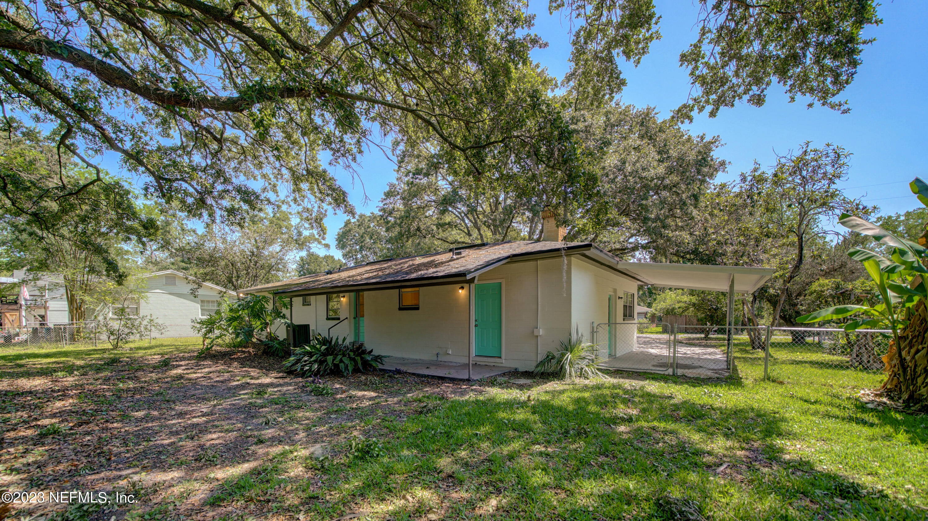 1130 Labelle Street Jacksonville, FL 32205 - Photo 23 of 24 a view of a backyard with large trees