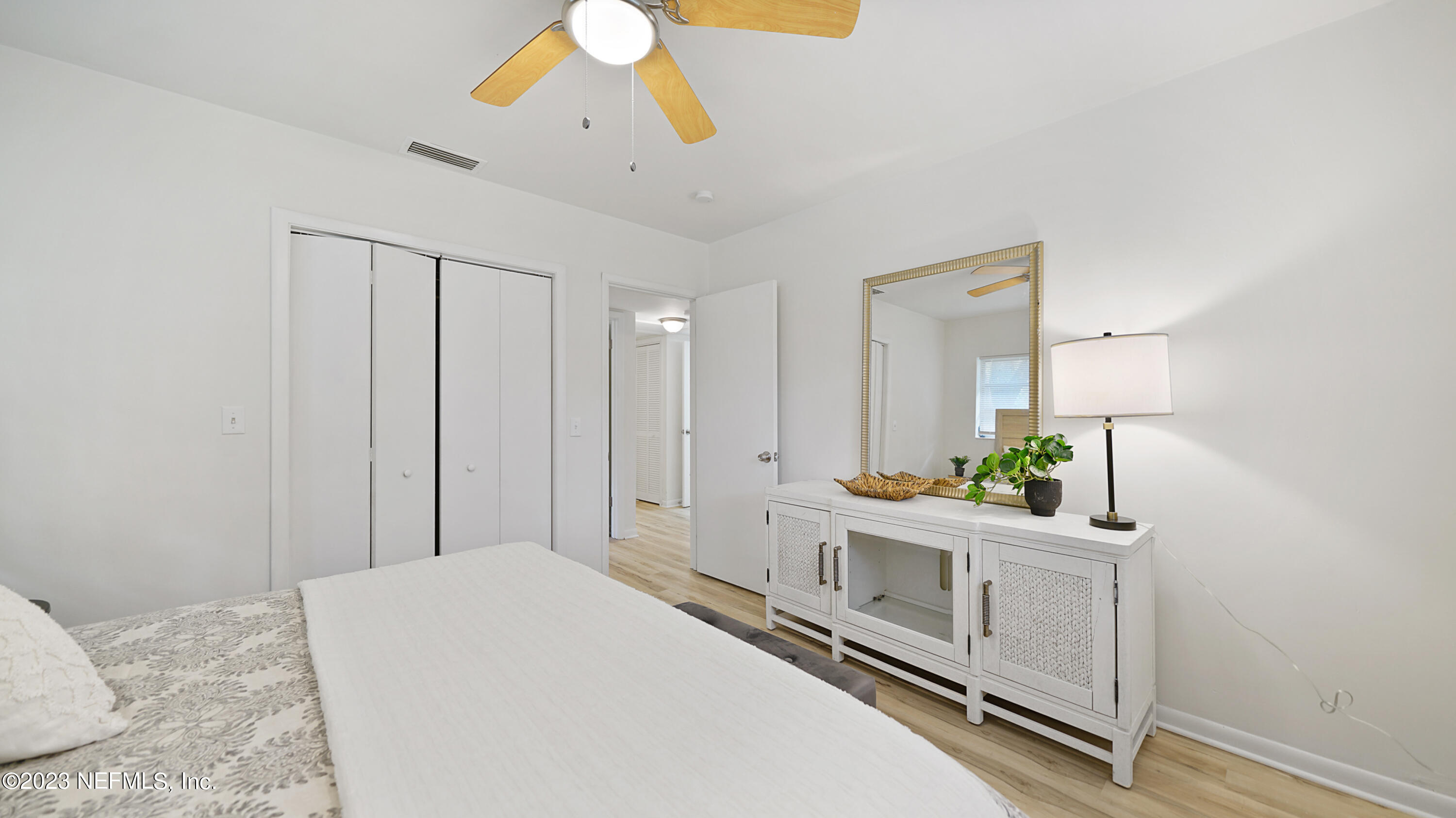 1130 Labelle Street Jacksonville, FL 32205 - Photo 24 of 24 a bedroom with a bed and a chandelier