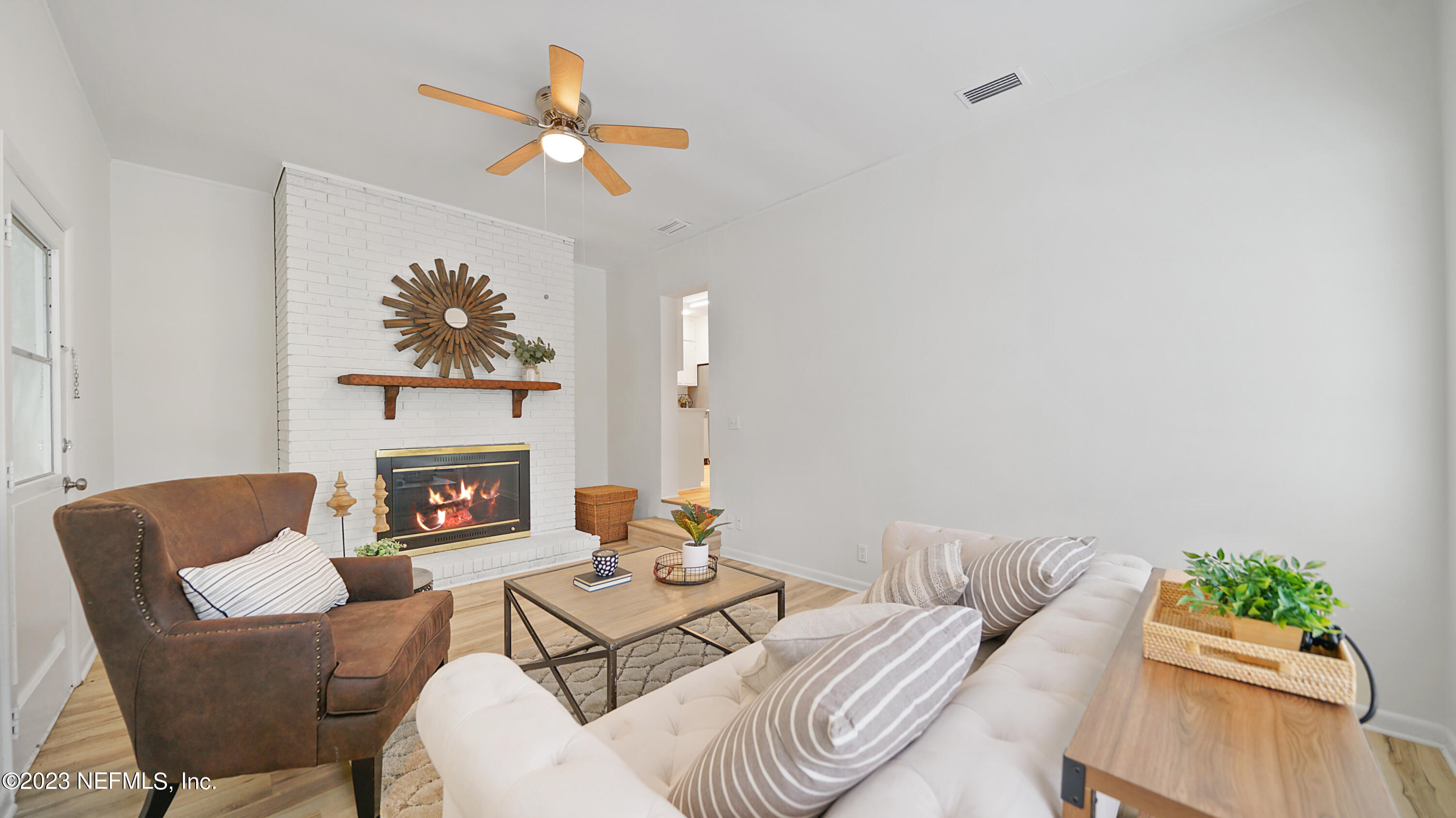 1130 Labelle Street Jacksonville, FL 32205 - Photo 6 of 24 a living room with furniture a fireplace and a potted plant