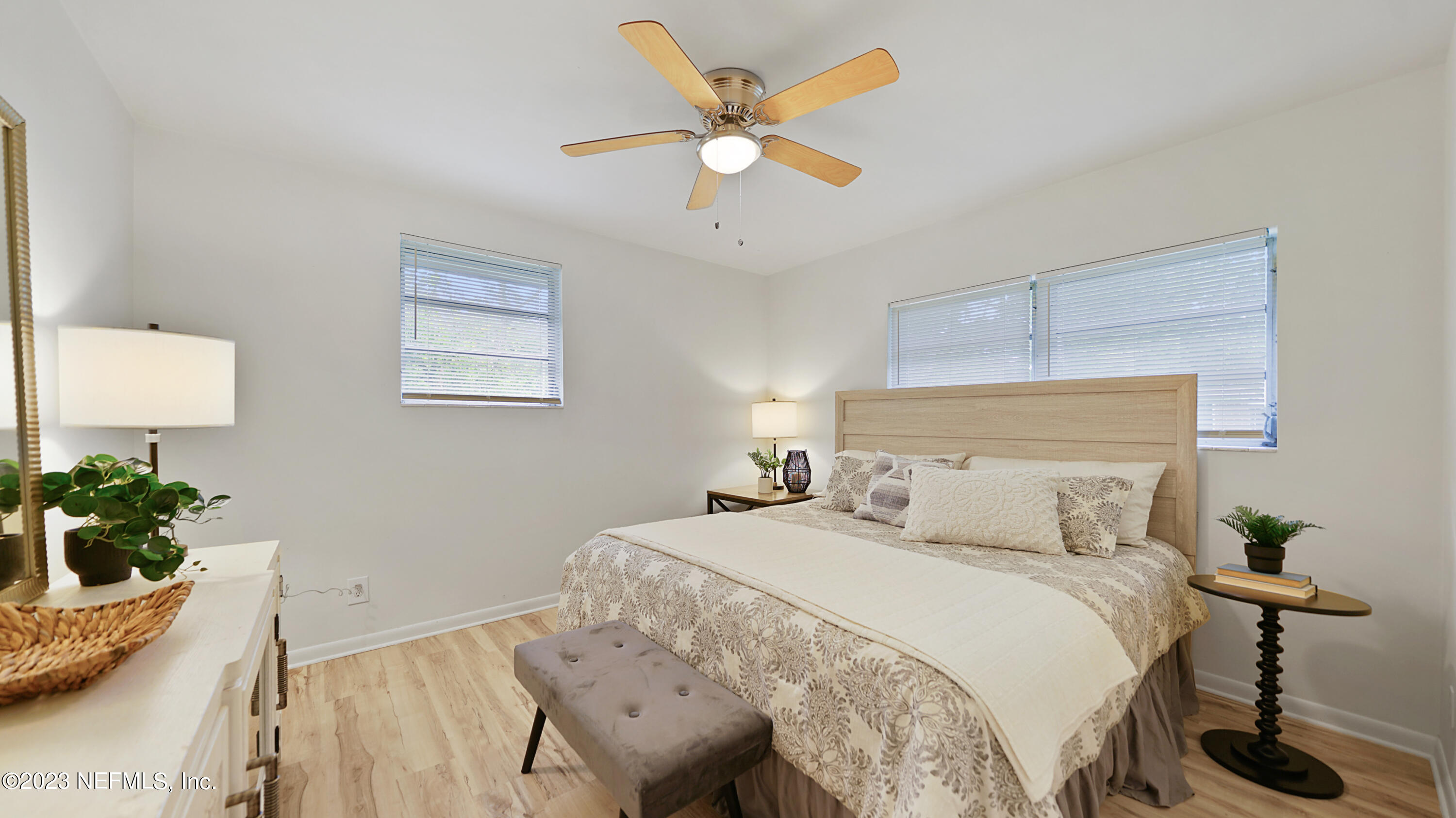 1130 Labelle Street Jacksonville, FL 32205 - Photo 9 of 24 a bedroom with a bed and a potted plant
