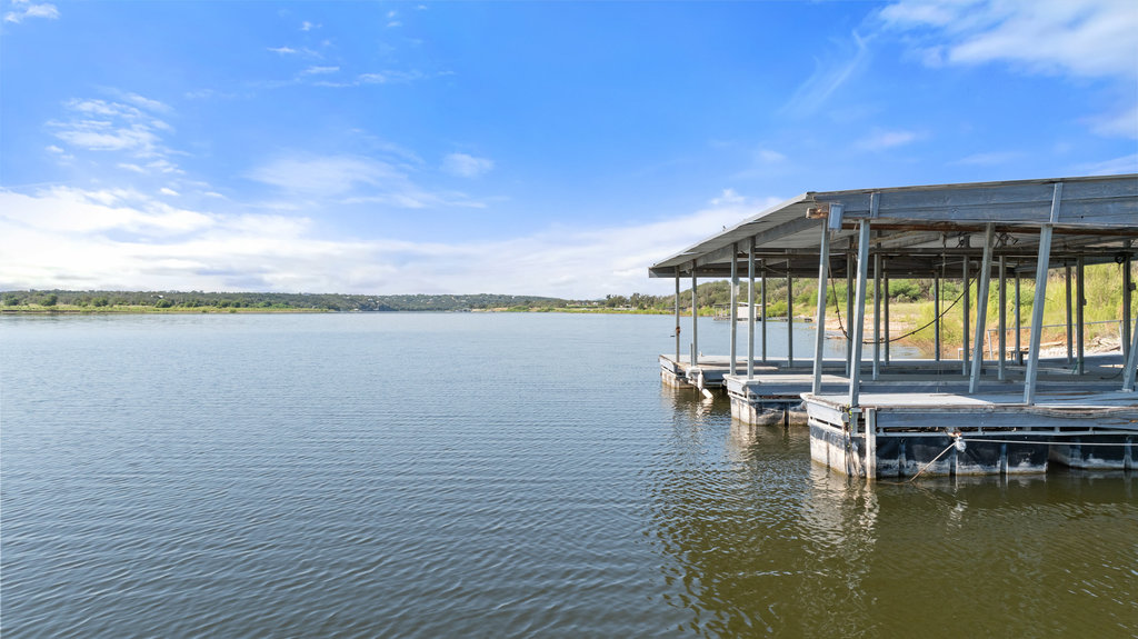 111 Swift Water Road Marble Falls, TX 78654 - Photo 14 of 37 a view of a lake with a table and chairs