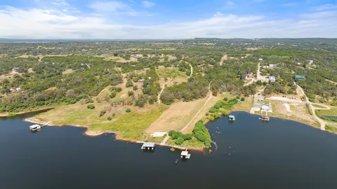 a view of a lake with houses in the back