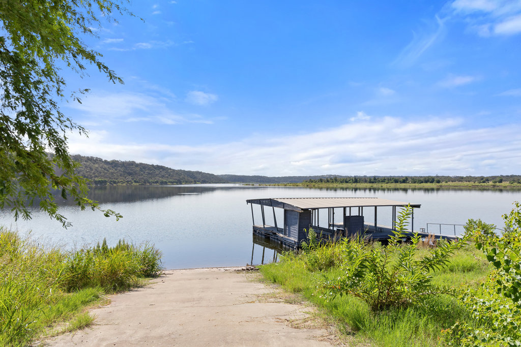 111 Swift Water Road Marble Falls, TX 78654 - Photo 18 of 37 a view of a lake with a mountain in the background