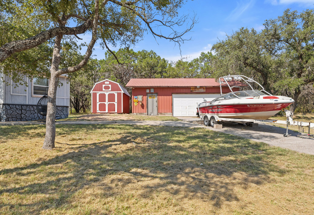 111 Swift Water Road Marble Falls, TX 78654 - Photo 25 of 37 a front view of a house with a yard