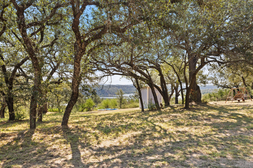 111 Swift Water Road Marble Falls, TX 78654 - Photo 26 of 37 a view of a yard with a tree