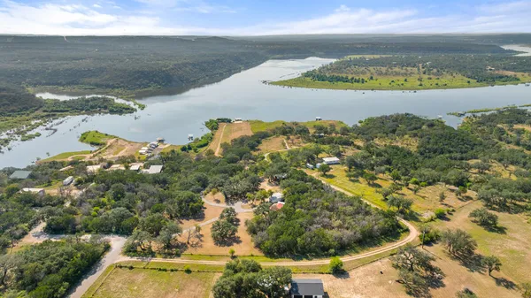 a view of a lake with a yard