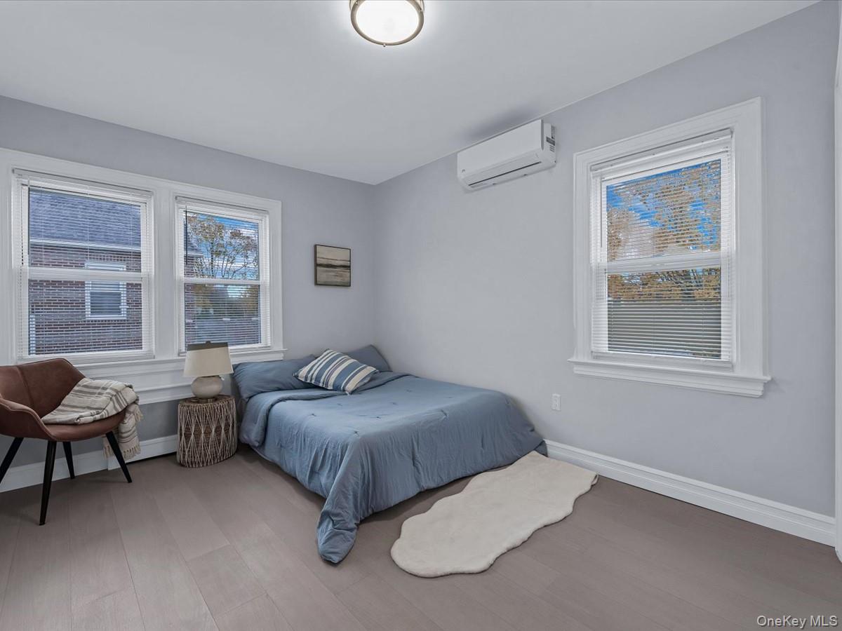 62 Essex Road Great Neck, NY 11023 - Photo 17 of 25 a bedroom with bed and a window