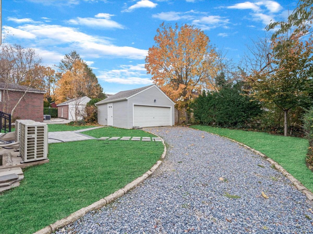 62 Essex Road Great Neck, NY 11023 - Photo 22 of 25 a view of a house with a yard