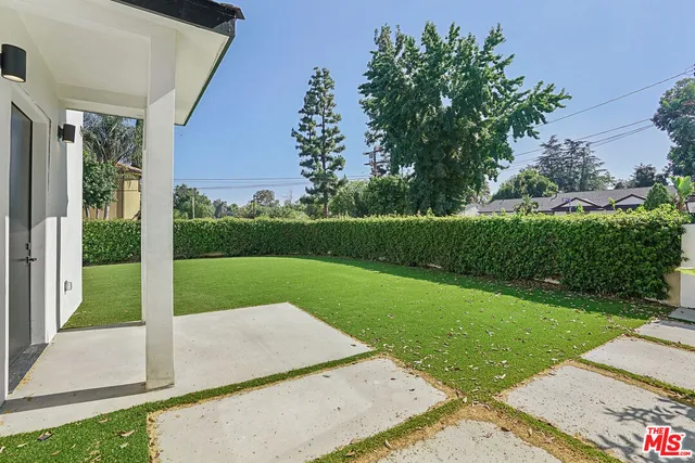 a view of a backyard with garden