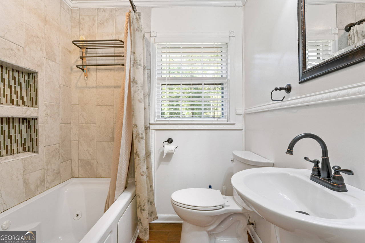 515 Valley Hill Road Stockbridge, GA 30281 - Photo 15 of 44 a bathroom with a sink toilet and shower