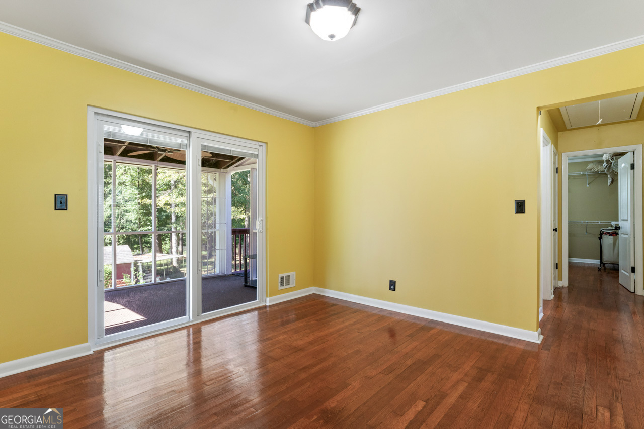 515 Valley Hill Road Stockbridge, GA 30281 - Photo 17 of 44 a view of a room with wooden floor and a window