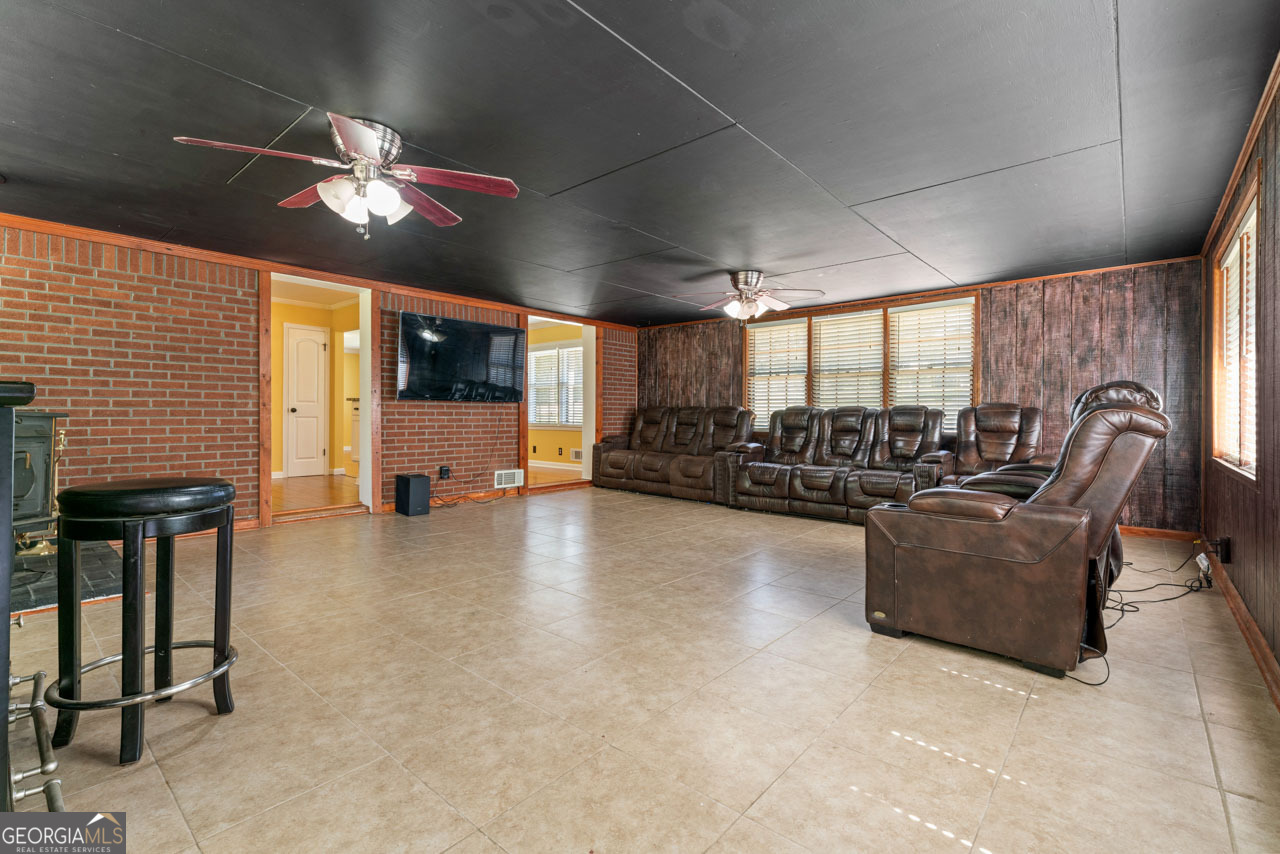 515 Valley Hill Road Stockbridge, GA 30281 - Photo 24 of 44 a living room with furniture and a flat screen tv