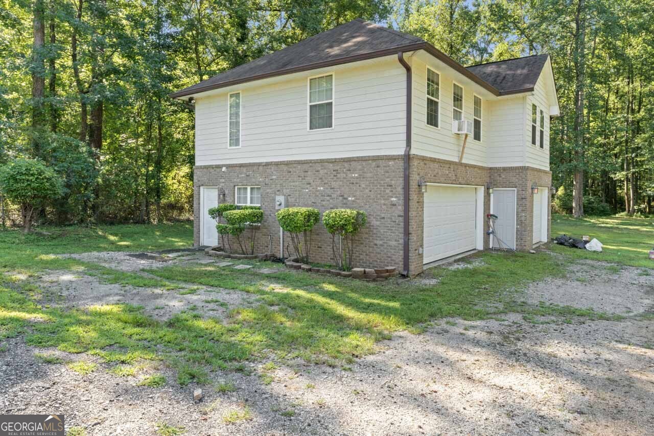 515 Valley Hill Road Stockbridge, GA 30281 - Photo 3 of 44 a view of a house with backyard and garden