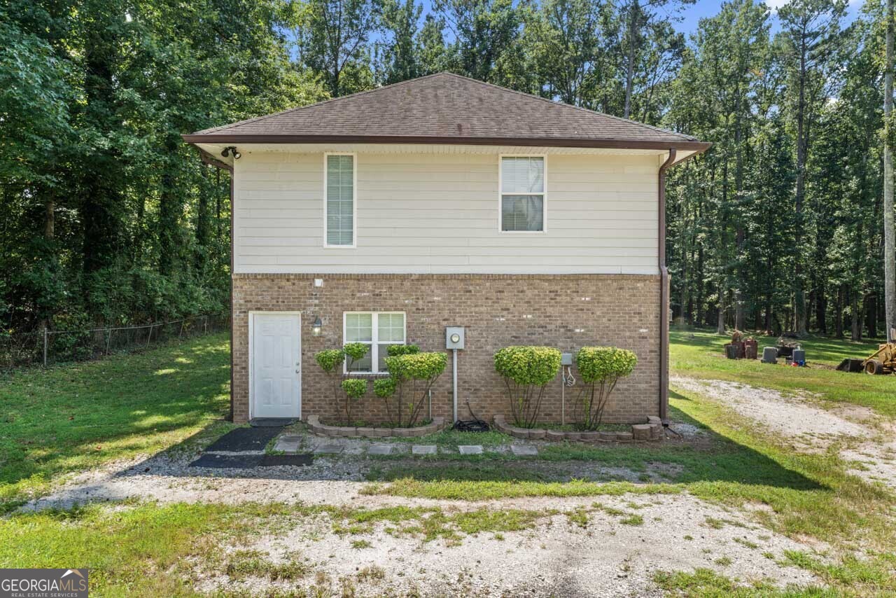 515 Valley Hill Road Stockbridge, GA 30281 - Photo 32 of 44 a front view of a house with garden