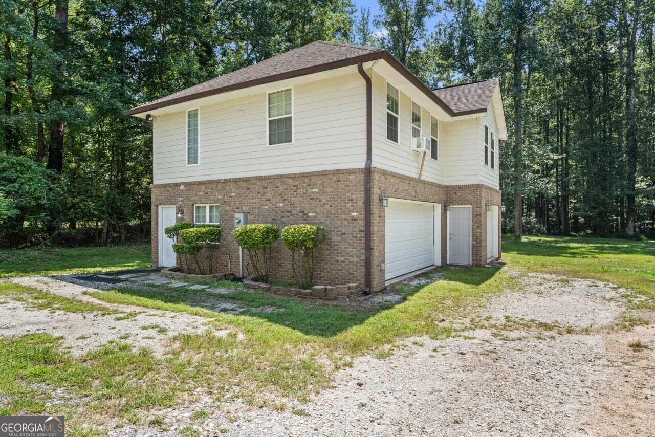 515 Valley Hill Road Stockbridge, GA 30281 - Photo 33 of 44 a view of a house with backyard and trees