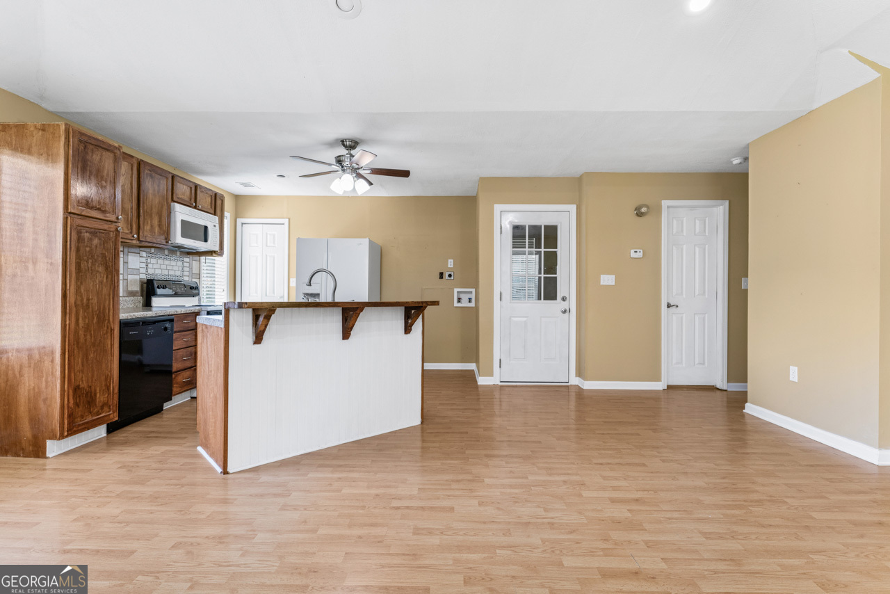 515 Valley Hill Road Stockbridge, GA 30281 - Photo 35 of 44 an entryway with a cabinet and a kitchen view