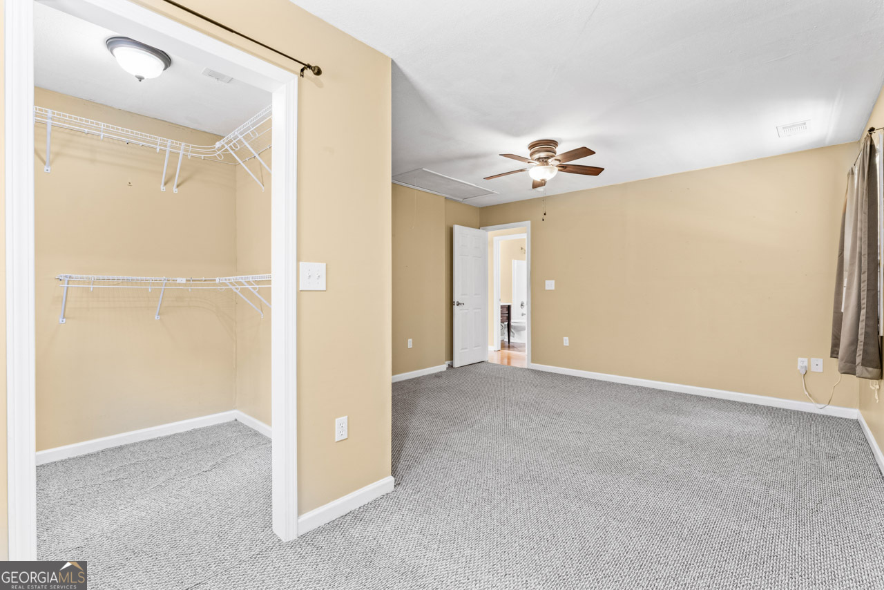 515 Valley Hill Road Stockbridge, GA 30281 - Photo 41 of 44 a view of an empty room with a ceiling fan