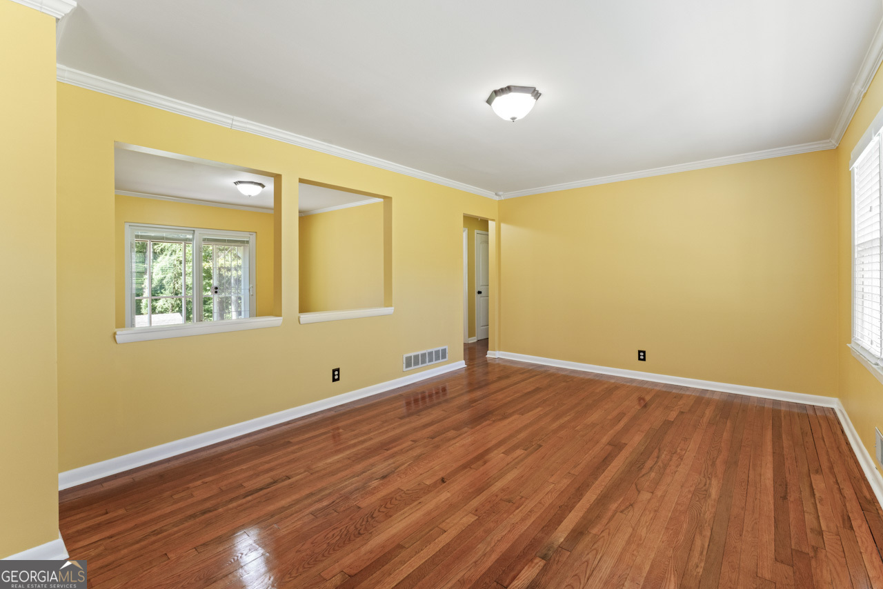515 Valley Hill Road Stockbridge, GA 30281 - Photo 9 of 44 a view of empty room with wooden floor and fan