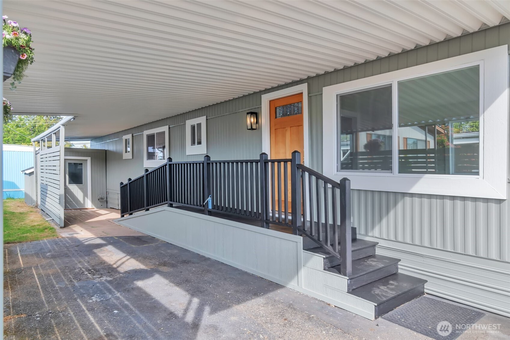 18501 52nd Avenue West, Unit 84 Lynnwood, WA 98037 - Photo 1 of 32 a view of a house with wooden floor and a wooden fence