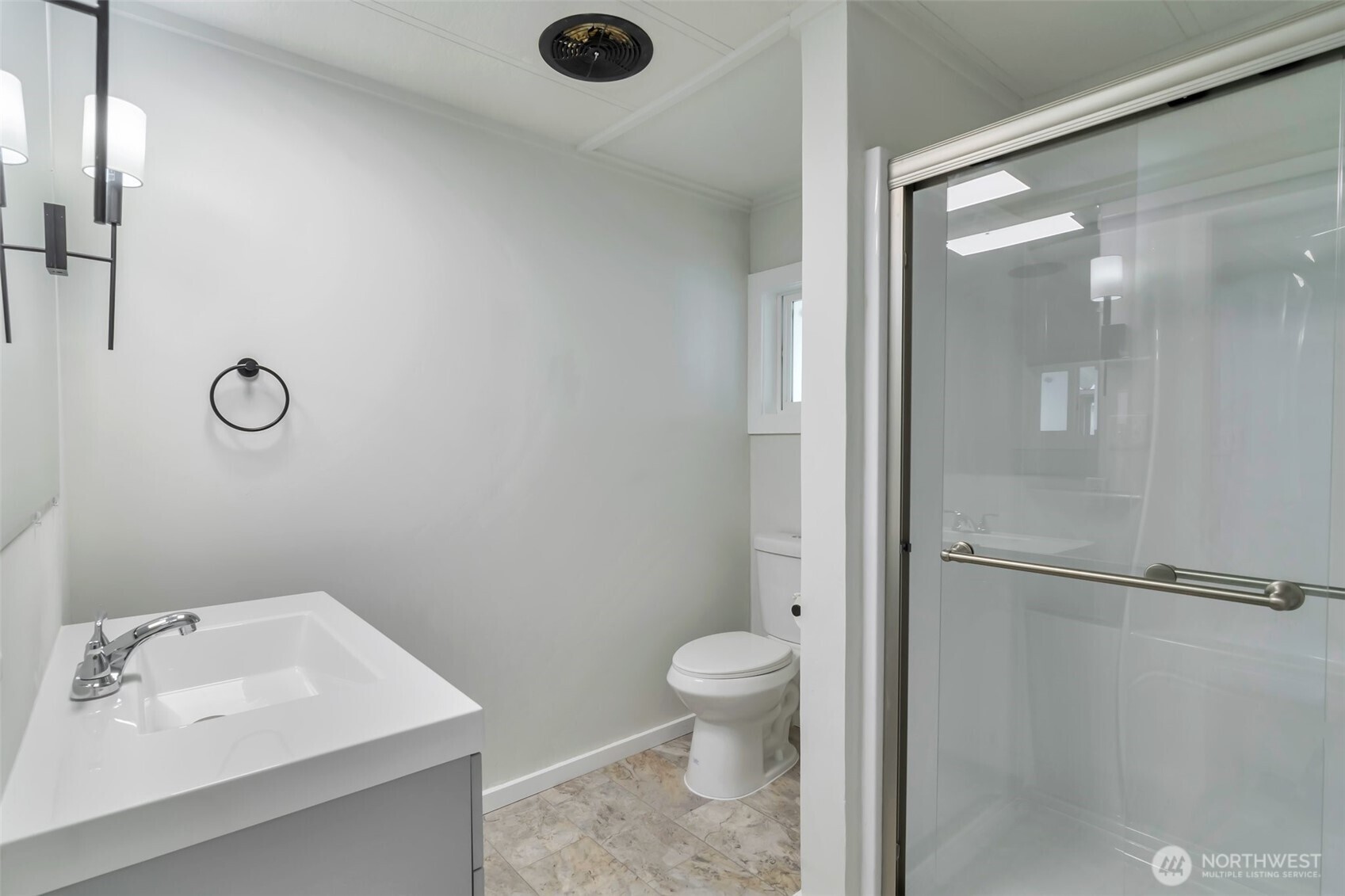 18501 52nd Avenue West, Unit 84 Lynnwood, WA 98037 - Photo 13 of 32 a bathroom with a sink a toilet and shower