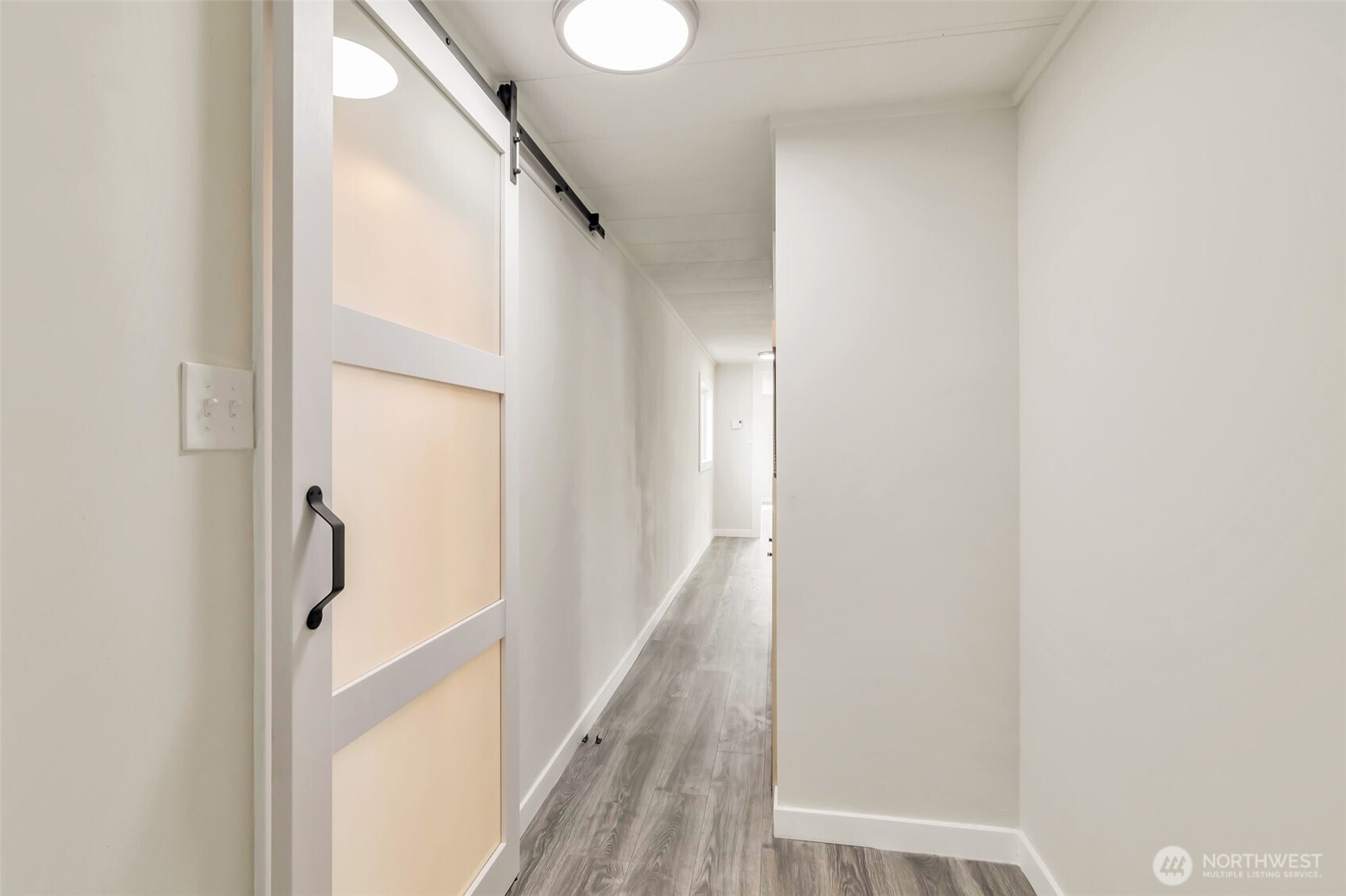 18501 52nd Avenue West, Unit 84 Lynnwood, WA 98037 - Photo 17 of 32 a view of a hallway with wooden floor and staircase