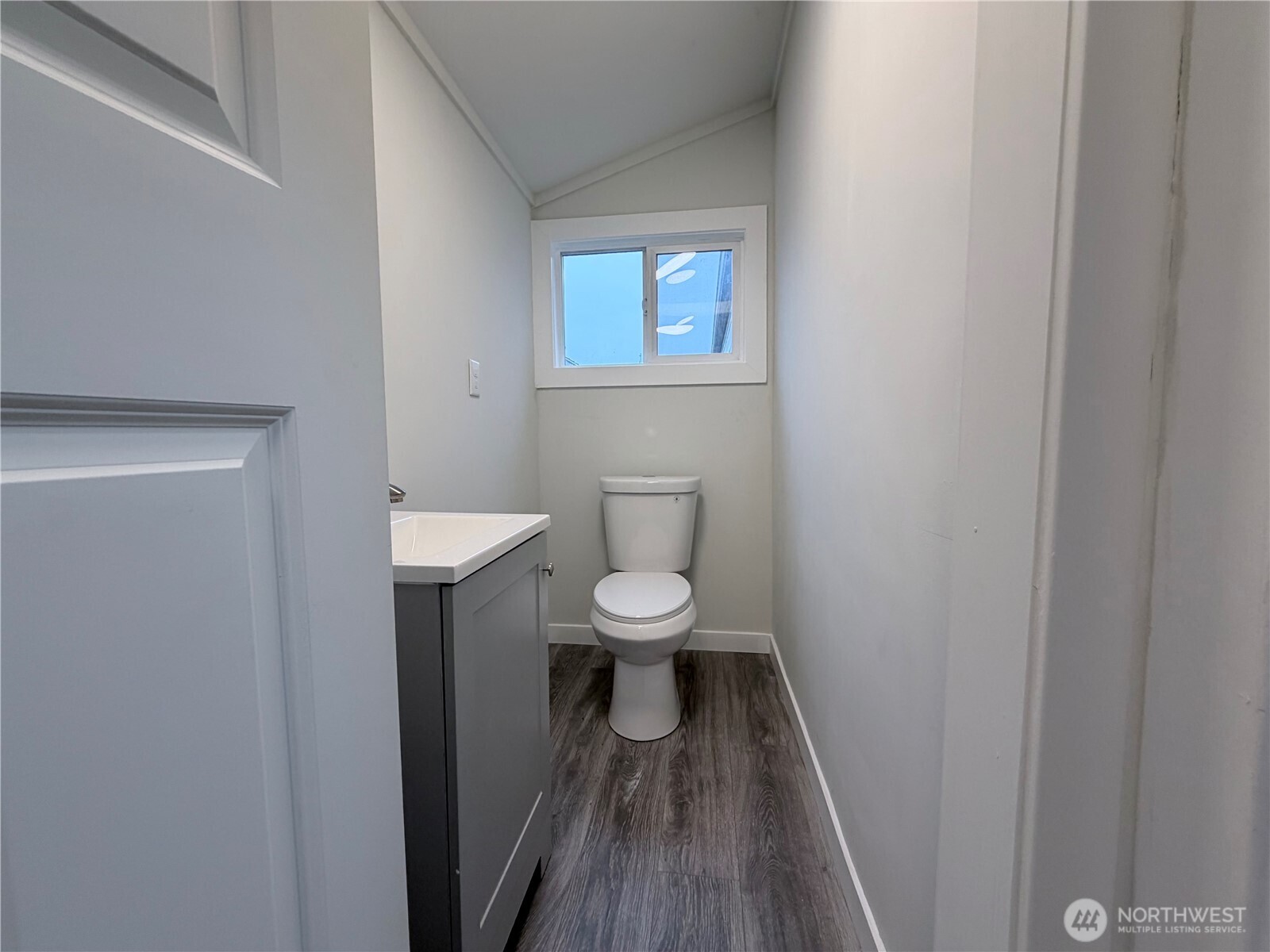 18501 52nd Avenue West, Unit 84 Lynnwood, WA 98037 - Photo 20 of 32 a bathroom with a toilet and a hardwood