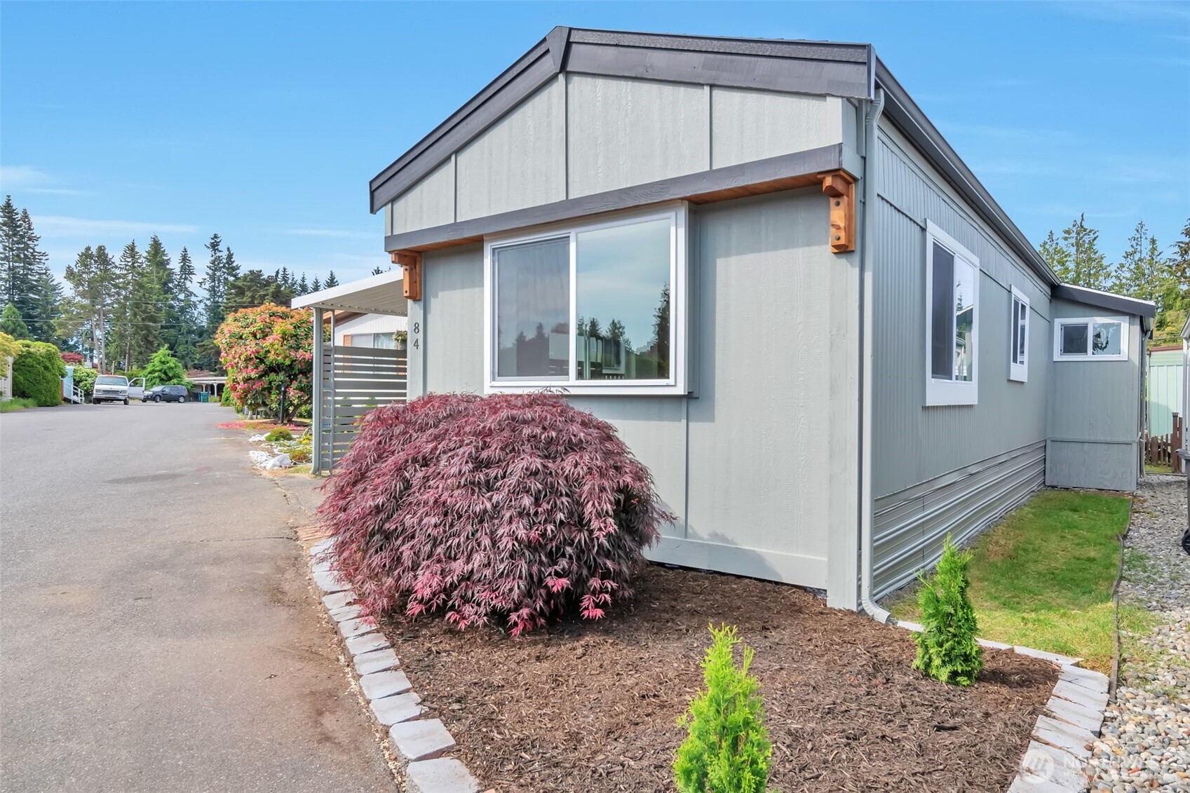 18501 52nd Avenue West, Unit 84 Lynnwood, WA 98037 - Photo 23 of 32 a view of a house with backyard and garden